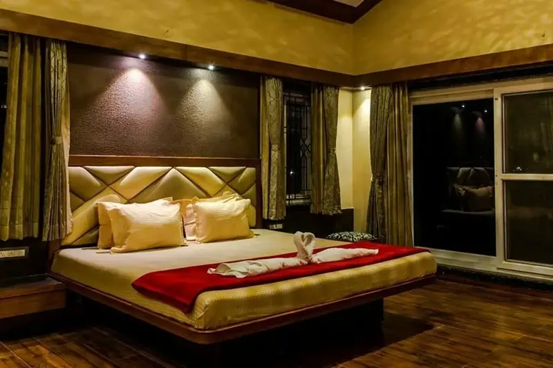 Romantic couple room with private amenities at Dandeli resort for honeymoon