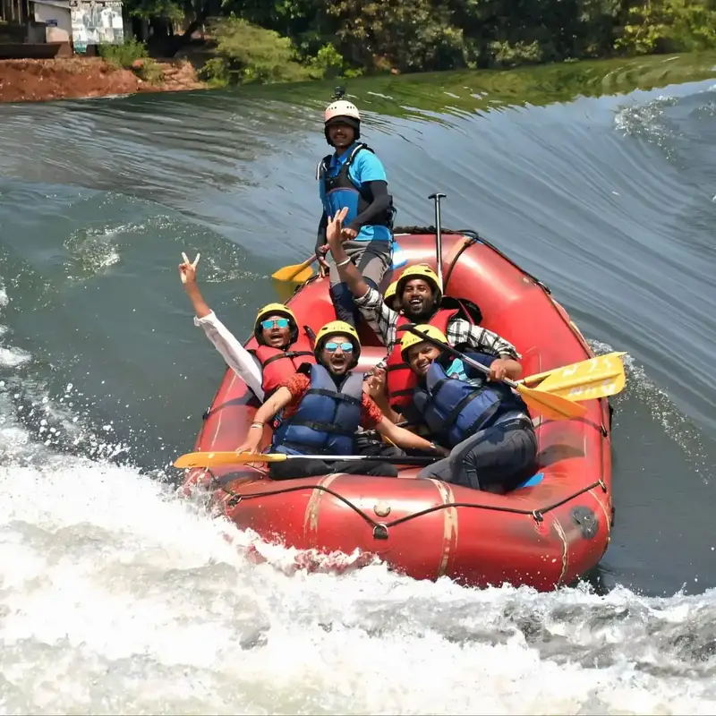 Adventure group rafting together through Kali River rapids in Dandeli