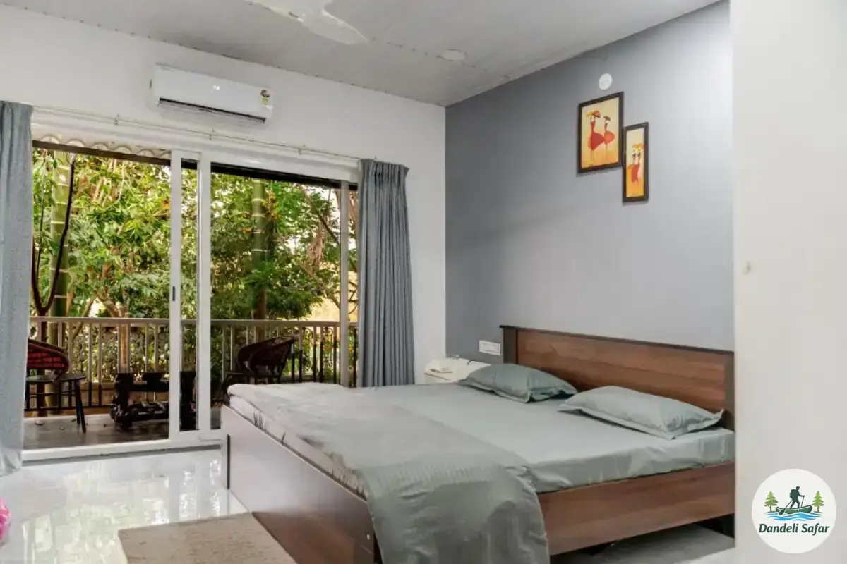 AC Deluxe cottage room with large window and natural light at B Hive Resort Londa