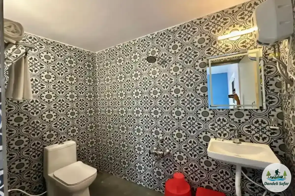 Clean attached washroom with modern fittings in AC Standard cottages at B Hive