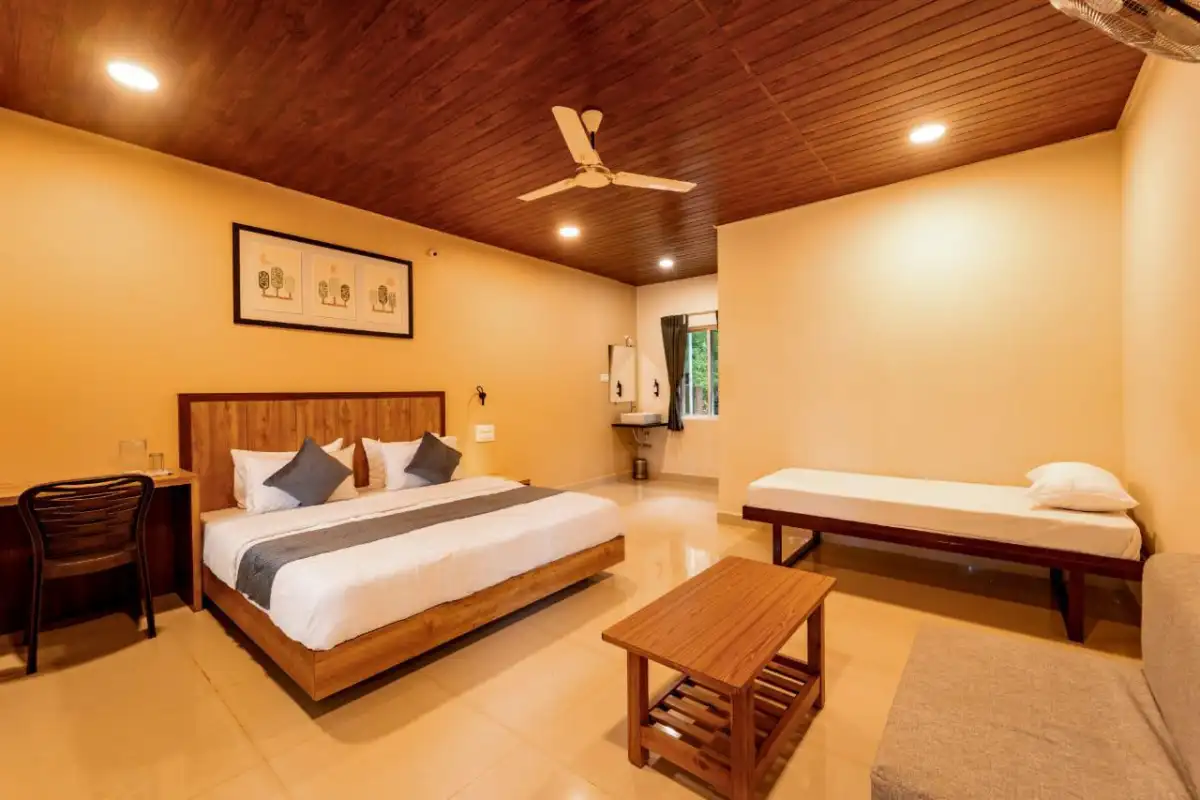 AC Deluxe room with comfortable bedding at Rain Forest Resort