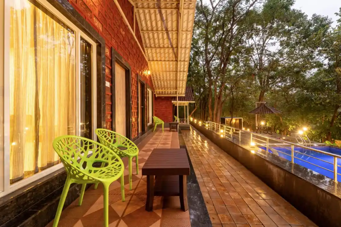 Poolside cottage with balcony at Rain Forest Resort near Ganeshgudi