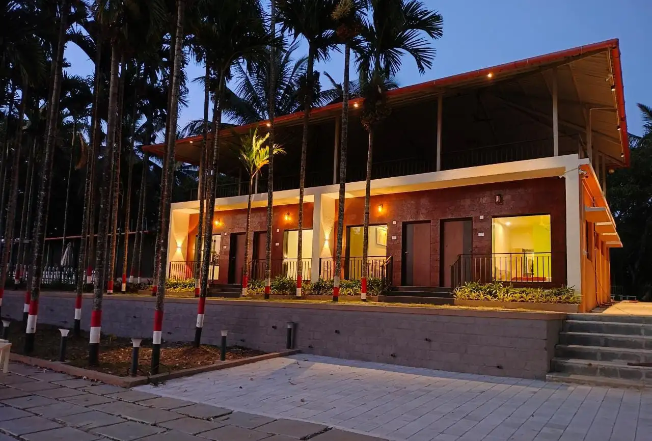 River Edge Retreat Dandeli riverside lawns and seating overlooking the Kali River