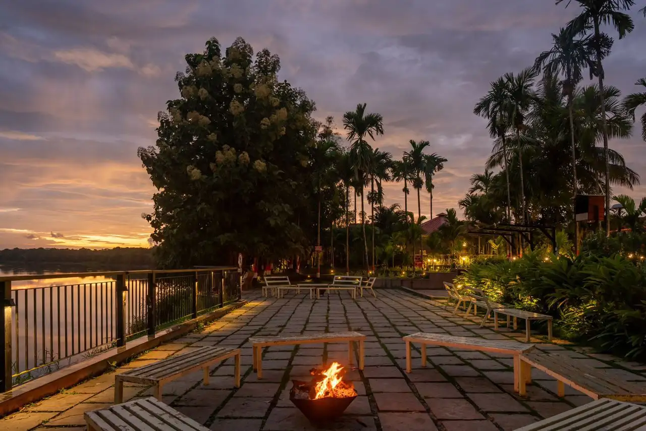 Garden walkway and cottage exteriors at River Edge Retreat Dandeli