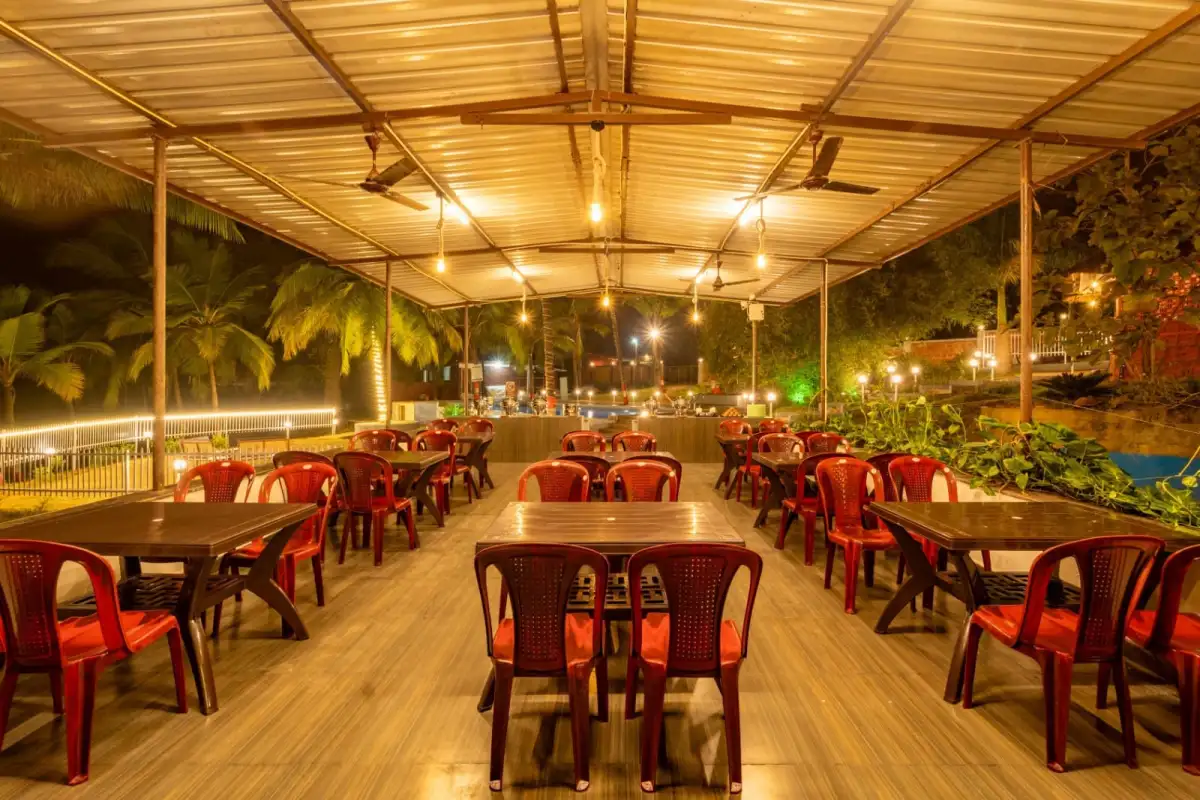 Indoor dining area with seating at Wild Mist resort Dandeli for group meals