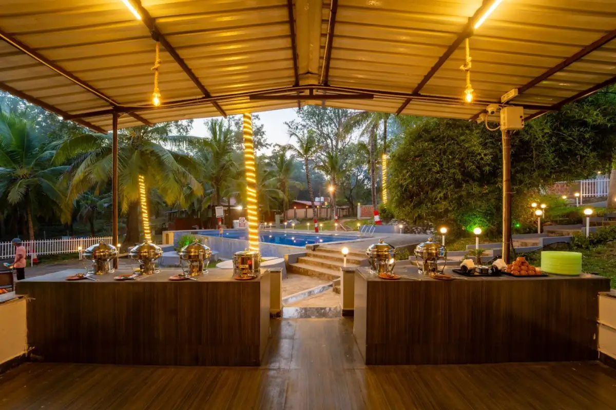 Spacious dining hall at Wild Mist Jungle Stay serving buffet meals in Dandeli