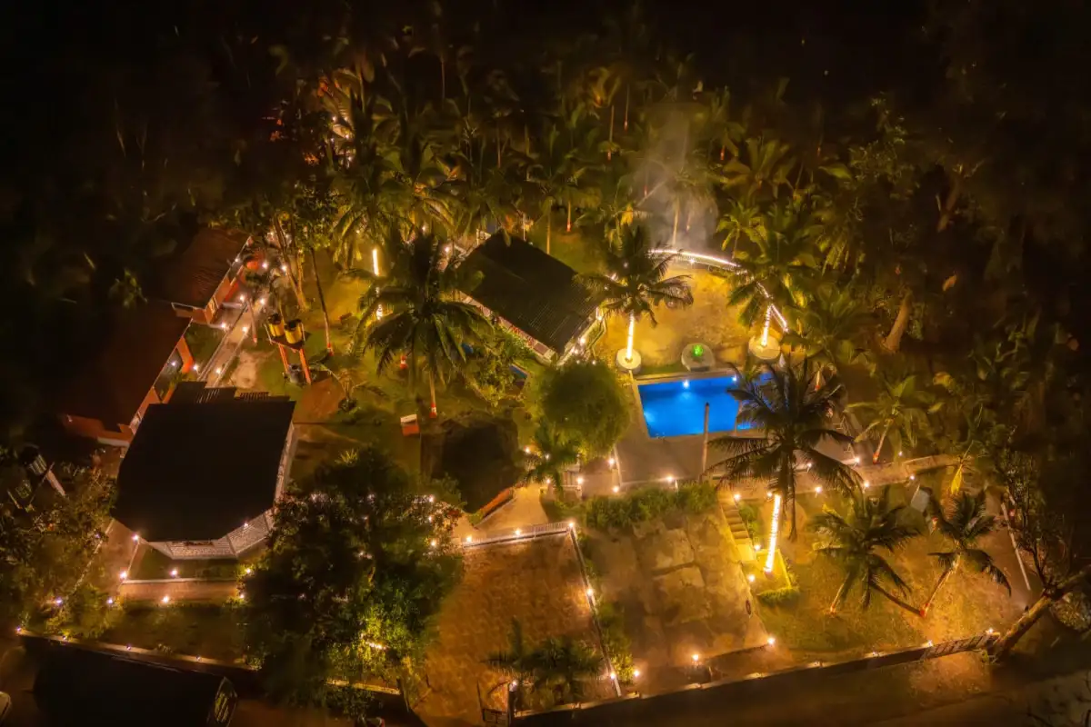 Aerial night view of Wild Mist resort Dandeli illuminated in Western Ghats forest